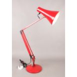 A Herbert Terry Anglepoise Model 90 desk lamp in red. H: 84cm. Condition good. Slight scratches to