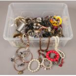 A box of costume jewellery. beads, bangles, necklaces examples etc