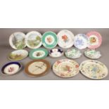 A quantity of mostly hand painted display plates.