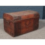 A vintage twin handle tin trunk. Missing lock.