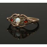 A 9ct gold opal and garnet dress ring. Size N 1/2, 1.84g.