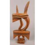 An African tribal hardwood carving. Marked Musili to the base. (27cm tall)