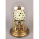 A German brass torsion clock with floral enamel dial.