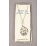 A vintage necklace with 'The Beatles' photo to the pendant. H:2.5cm.