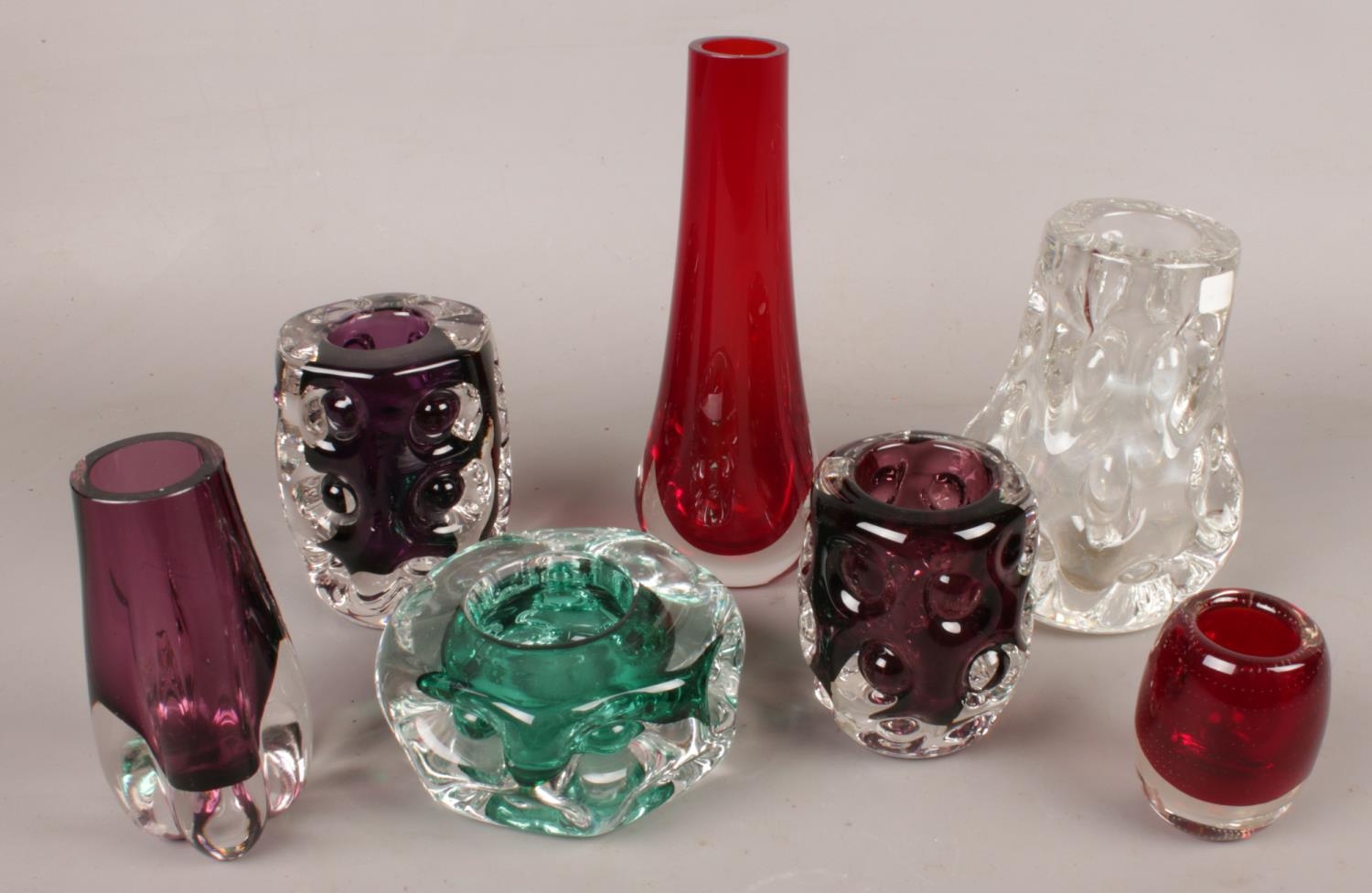 A quantity of coloured art glass. Including Liskeard glass, slender vase, etc.