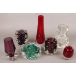 A quantity of coloured art glass. Including Liskeard glass, slender vase, etc.