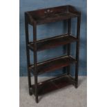 A mahogany four shelve open bookcase.