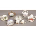 A quantity of miniature ceramic teawares. Including full teaset, cups & saucers, teapots, etc.