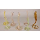 A quantity of art glass snakes along with a similar art glass sea horse.