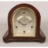 A Gustav Becker oak cased dome top mantel clock.