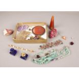 A tray of minerals. Includes agate obelisk, amethyst crystal, fluorite beads etc.