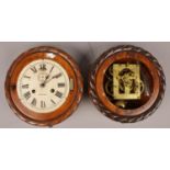 Two carved mahogany clocks by Ansonia clock company with rope twist borders. One missing clock dial.