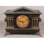 An ornate Wm.L. Gilbert marble effect 8 day mantel clock. Chiming on a coil gong.