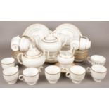 A quantity of ceramic gilt bordered tea/dinnerwares. Including teapot, sandwich plates, cups &