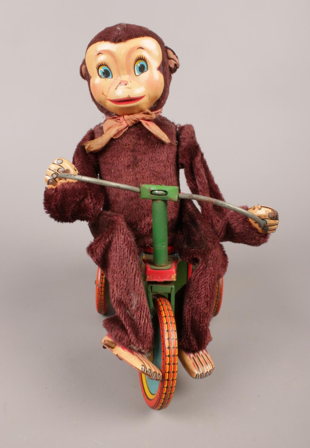 A Japanese made monkey on a tin plate tricycle. H:22cm, W: 10cm. Condition fair. Will need some - Image 3 of 4