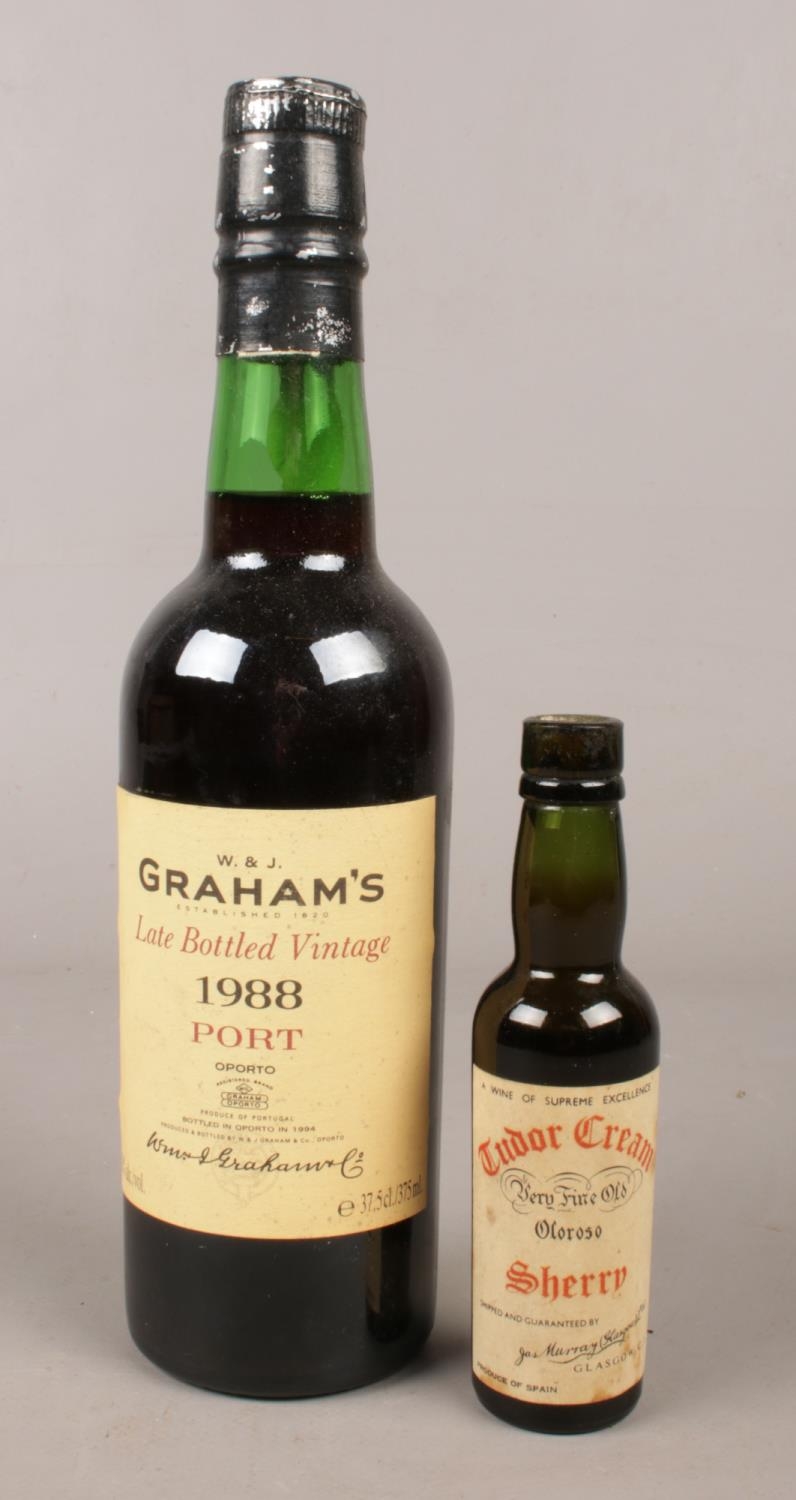 Two full and sealed bottles of alcohol. Graham's 1988 port and Tudor Cream sherry.