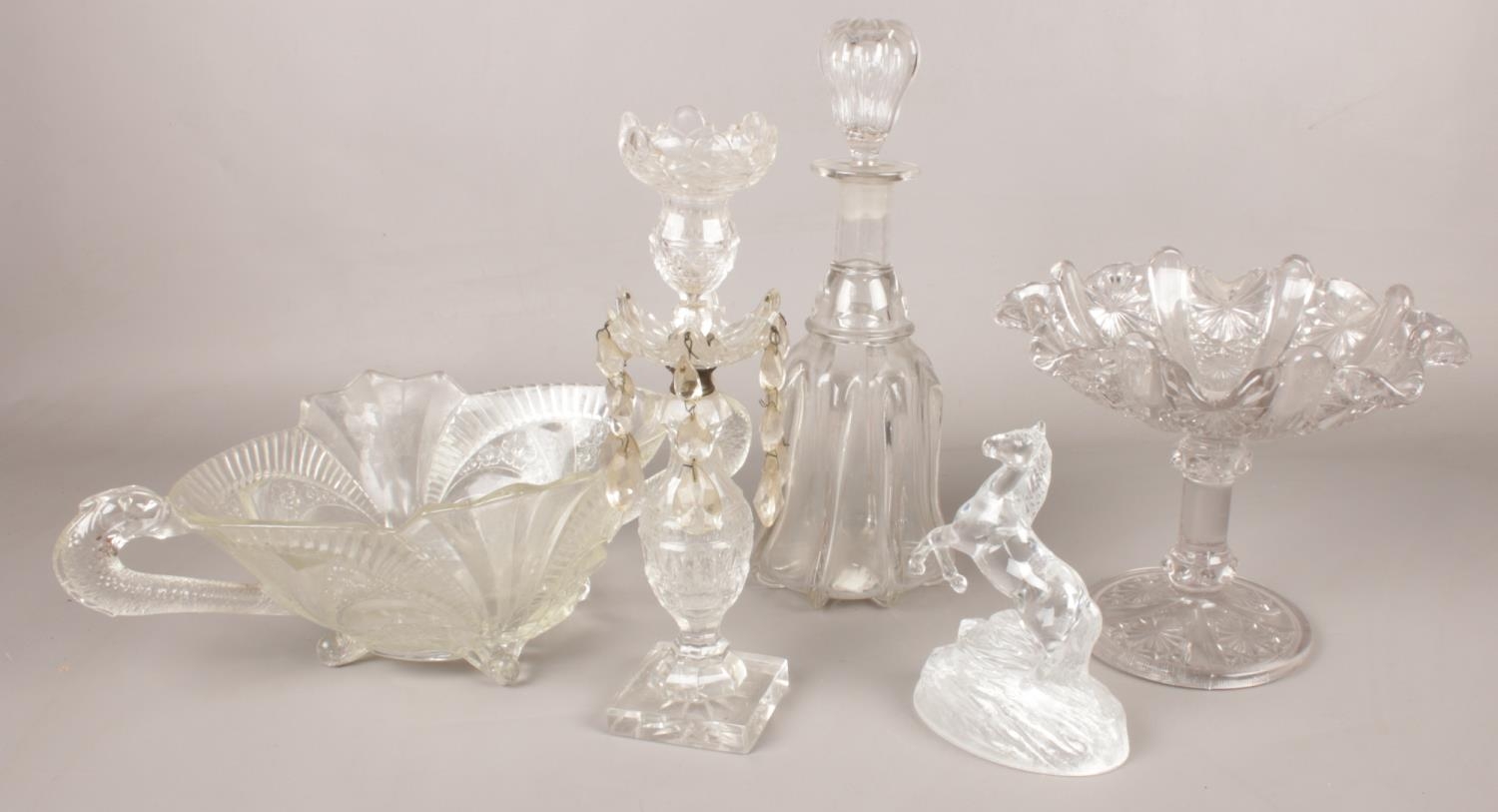A quantity of cut glassware. Including candlestick light, decanter, horse paperweight, pedestal