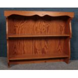 A stained Pine plate display rack along with two copper bed warmers and a brass fire guard. (Dresser