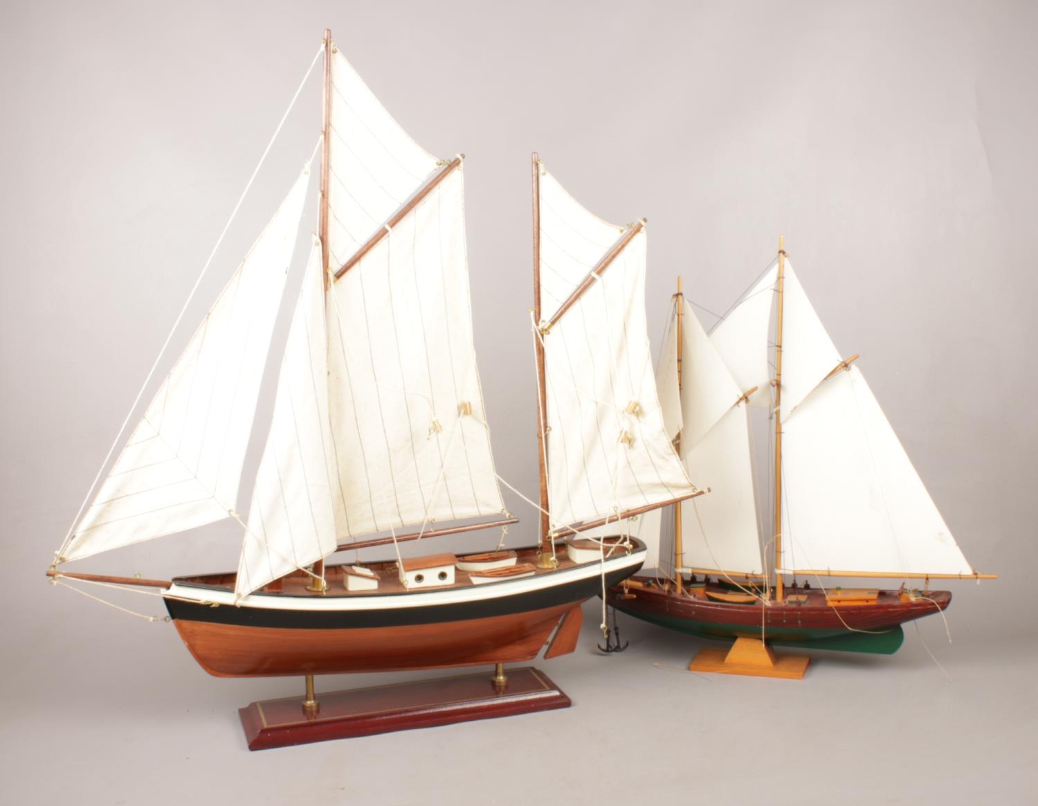 Two Model ships. (68cm height 61cm width biggest example)