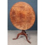 A Georgian mahogany snap top table. Diameter (86cm)