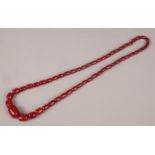 A string of graduated cherry bakelite beads.
