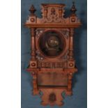 A carved mahogany wall clock case. Parts of finial missing.426