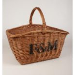 A large Fortnum & Mason wicker basket with handle. H: 45cm, W:52cm.