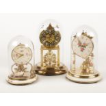 Three brass torsion clocks. Incudes Schatz example.