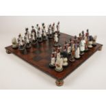 A Wellington and Napoleon composite chess set, complete with board.