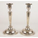 A near pair of early 20th century silver candlesticks. With detachable nozzles. (21.5cm).
