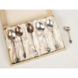 A cased set of six sterling silver spoons with Paua shell terminals. To include a silver mustard