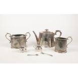 A group of silver plate. Teapot, coffee pot, mustard pots examples etc.