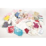 A box of dolls clothes. Includes knitted examples.