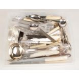 A box of loose silverplated flatware. Including ladles, Walker & Hall, knives, spoons, etc.