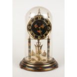 A Kundo anniversary torsion ball pendulum clock.