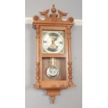 A modern oak Timemaster quartz wall clock. Westminster Whittington chiming.