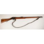 A long lever Martini "Enfield made" Mk4 rifle 577.450 dated 1887 having its original sling and