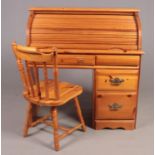 A Modern Pine roll top desk & spindle back chair. (110cm height, 104cm width, 48cm depth)