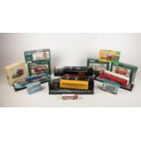 A collection of thirteen die cast Corgi haulage trucks & buses. Comprising of a ERF Curtain Side -