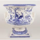 A large ceramic blue & white planter with transfer print decoration depicting peacocks and