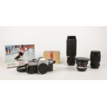 Canon AE-1 camera. (with box) To include Canon FD 35-105mm lens, Canon FD 100-300mm lens, Panagor
