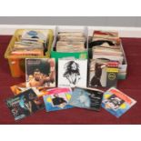 Three boxes of 45 rpm vinyl records. Peggy Lee, Bob Marley & The Wailers, Jennifer Rush, Marvin Gaye