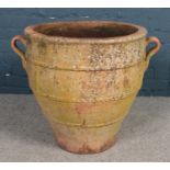 A large terracotta garden planter. (height 61cm, diameter 60cm).