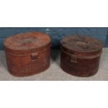 Two tin hat boxes.