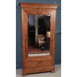 A French figured Walnut carved armoire with single mirrored door. Oak lined. (205cm height, 95cm