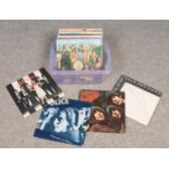A box of LP records. Includes The Beatles, The Police, Blondie etc.