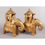 A pair of pottery gilt decorated ornamental elephants.