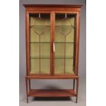 A Edwardian Mahogany astragal glazed display cabinet. H: 176cm, W:100cm, D:35cm. Overall condition