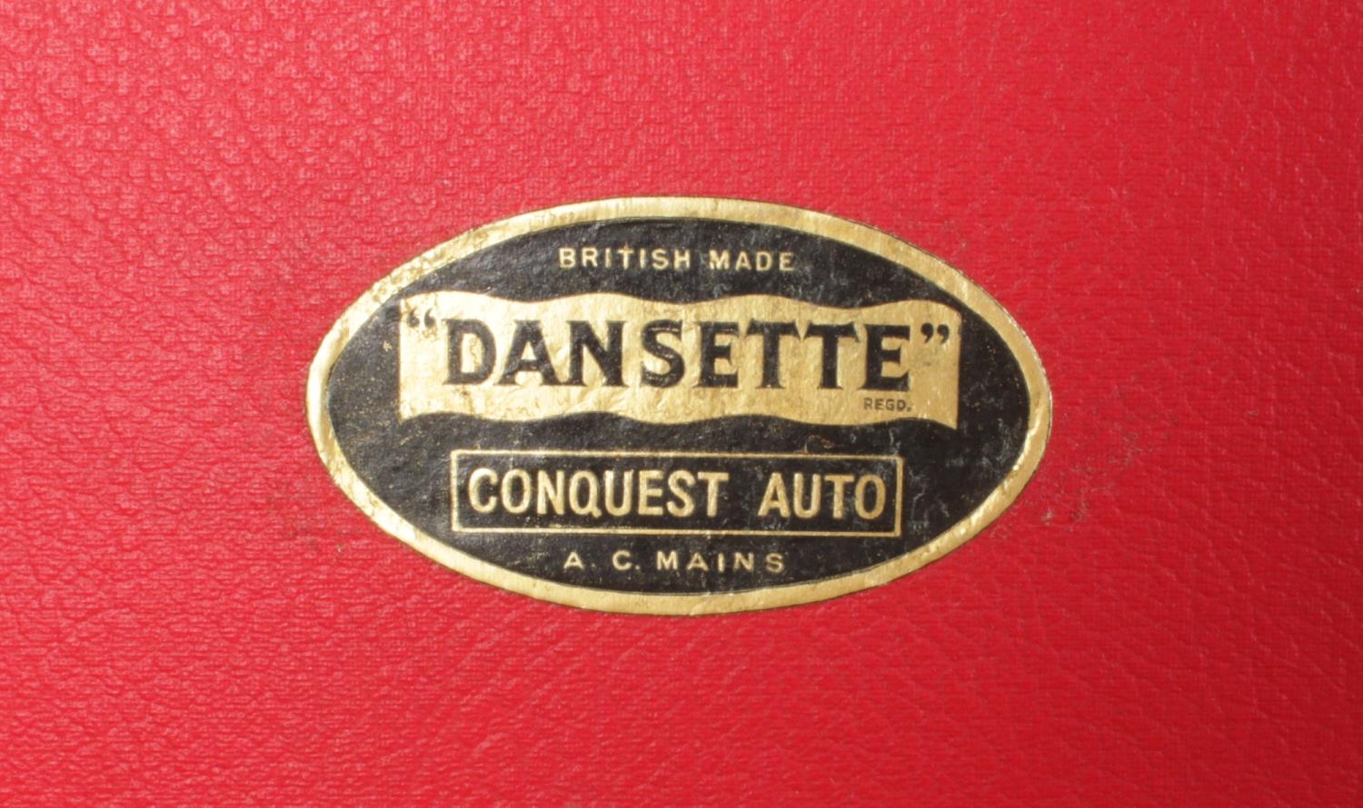 A Dansette 'Conquest Auto' portable record player (missing legs) in red and cream. H:25.5cm, W: 40. - Image 3 of 3