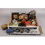 A box of collectables. Includes carved wooden bust, cork display, oriental napkin rings etc.